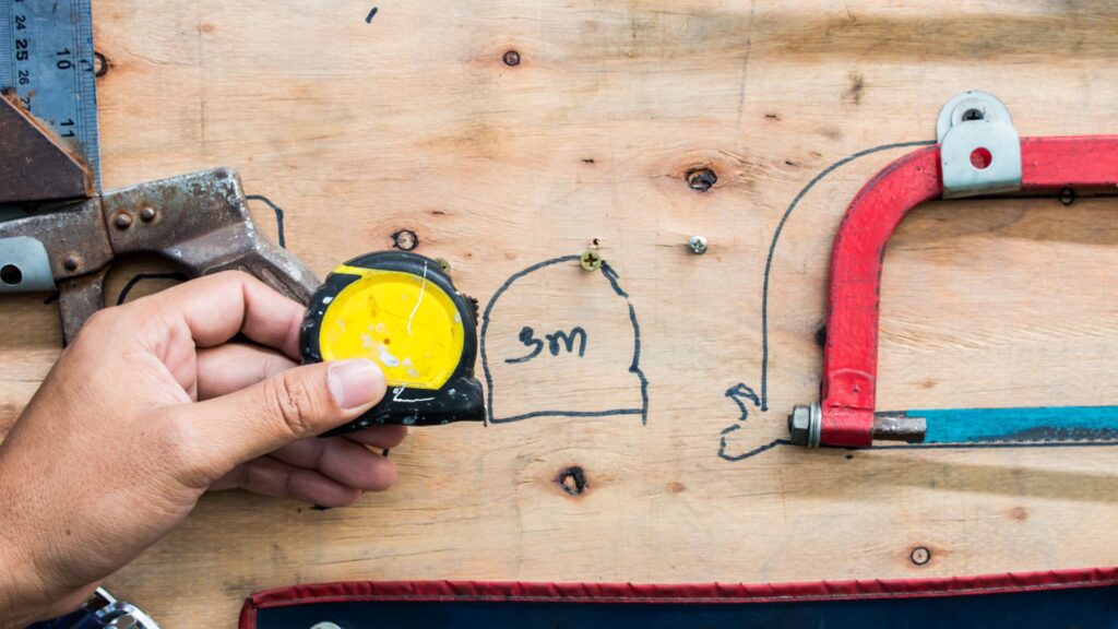 measuring tape on a wooden holder