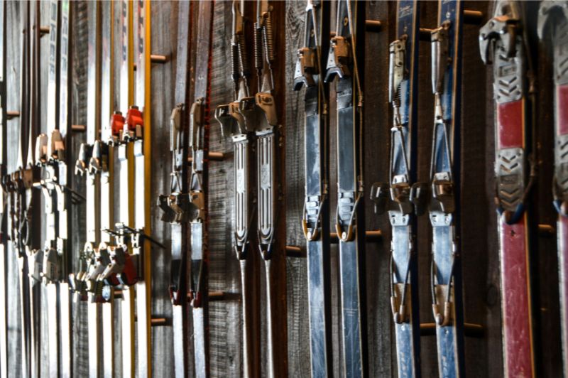 Row of skis on the wall